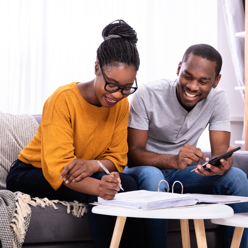 young couple at home doing accounts