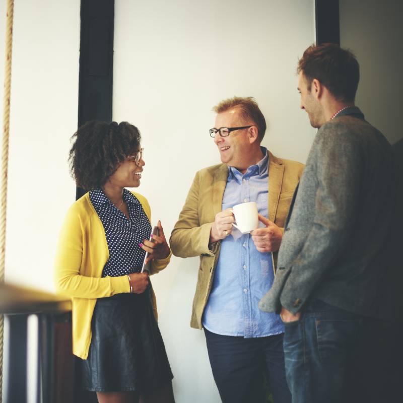 three office workers having a chat