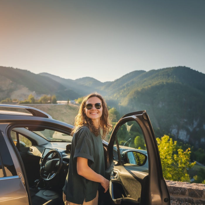 woman on car road trip