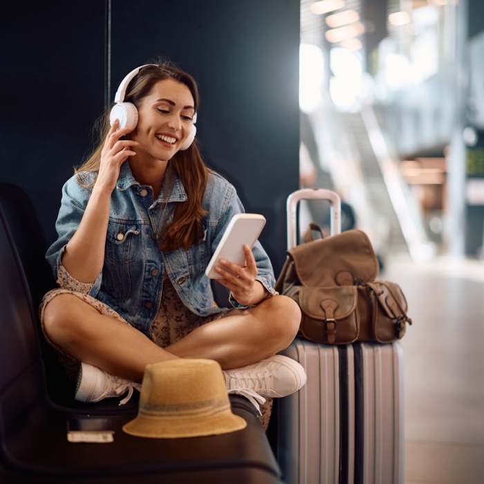 young woman listening to podcast
