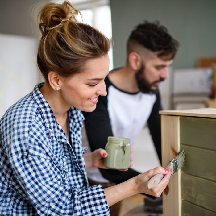 couple painting house