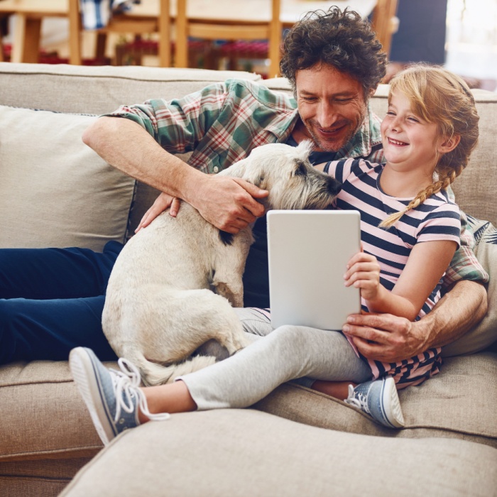 father and daughter and dog at home