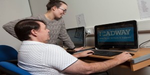 A client of headway services working on a laptop
