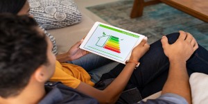 couple at home looking at BER rating on tablet