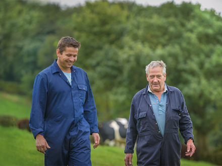 Farmers walking in field