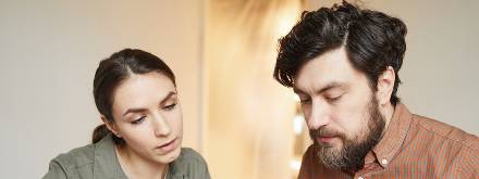 couple at home doing accounts