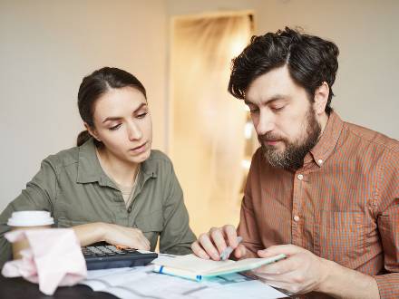couple at home doing accounts
