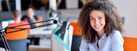 young female office worker at desk
