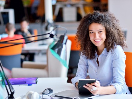 young female office worker at desk