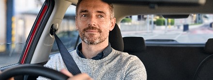 man driving car