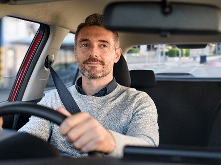 man driving car