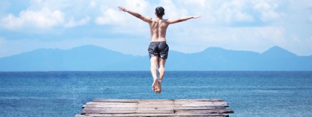 man jumping into the sea