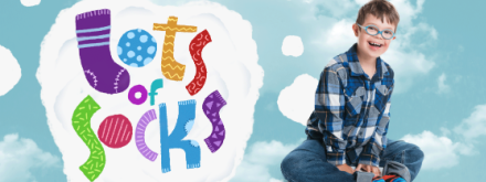 Child launching lots of socks down syndrome ireland campaign