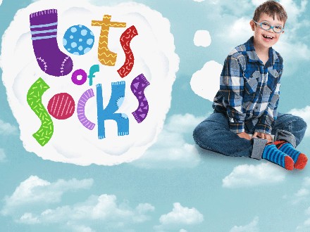 Child launching lots of socks down syndrome ireland campaign