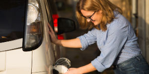 woman recharging car