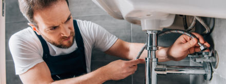 plumber fixing sink