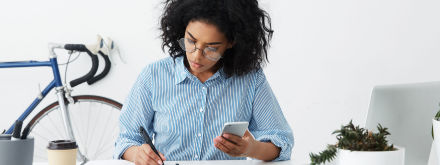 woman calculating on phone