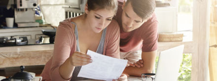 couple at home doing calculations