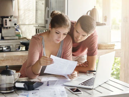 couple at home doing calculations
