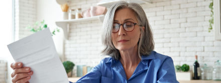 woman in kitchen doing paper work