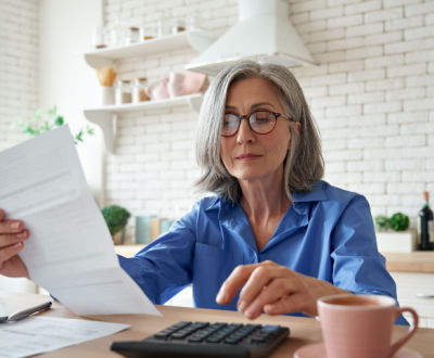 woman in kitchen doing paper work