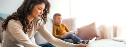 woman at home on tablet