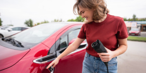 woman charging ev car
