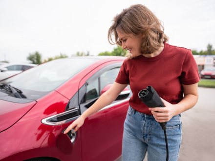 woman charging ev car