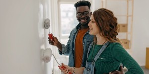 couple painting house