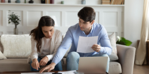 Couple at home doing paperwork