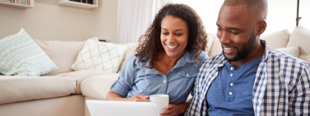 couple at home on laptop