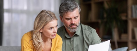 couple at home doing paperwork