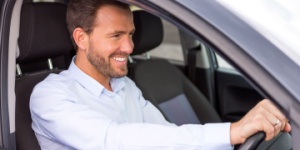 man driving car