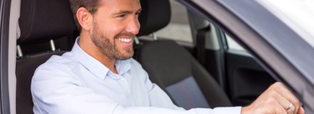 man driving car
