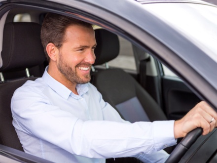 man driving car