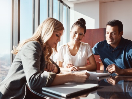 female financial advisor advising a couple