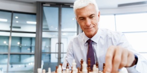businessman at chess board