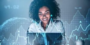 smiling businesswoman working on laptop