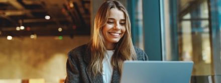 smiling business woman at laptop