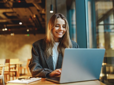 smiling business woman at laptop