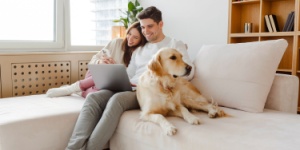 couple at home with dog