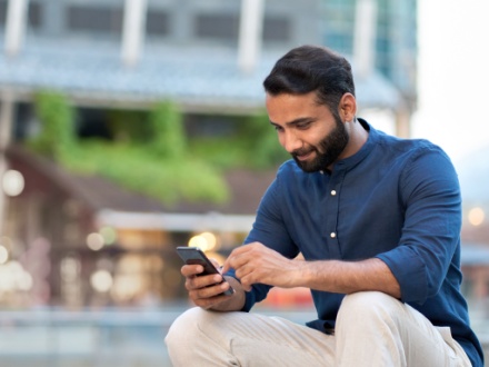 man sitting with phone