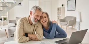 older couple at home with laptop