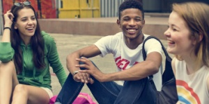 three young teenagers having fun