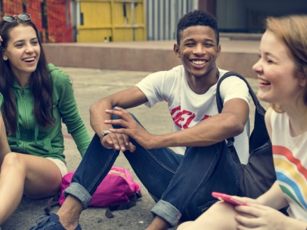 three young teenagers having fun
