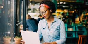 woman in coffee shop on laptop