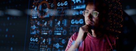 man looking at dashboard graphics