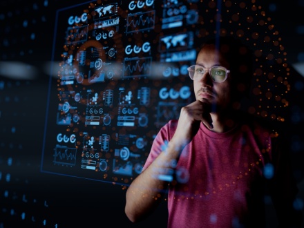 man looking at dashboard graphics