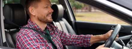 man driving car