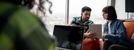 group of people in office on laptops